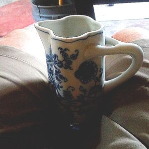Blue and white milk holder